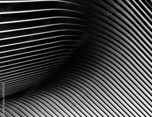 Metallic structure in the shape of waves, in black and white, with fine art processing