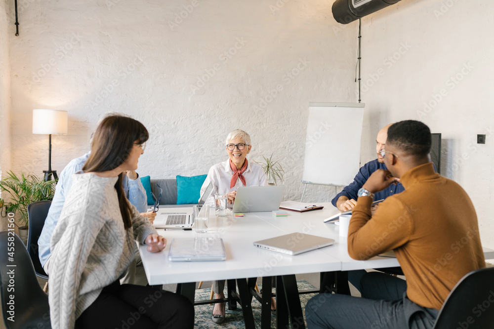 © Mihajlo Ckovric/Stocksy - Businesspeople having a meeting in the office © Mihajlo Ckovric/Stocksy - Businesspeople having a meeting in the office