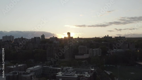 Aerial raising shot during sunset with buildings