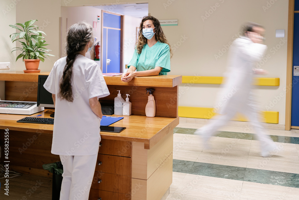 Doctor in White Coat Using Phone Doctor in White Coat Using Phone