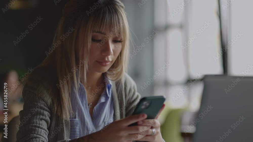 Investor Checking Stock Market Data On Screen Mobile Phone. Asian woman trading stock market on smart phone with stock market financial screen. cryptocurrency price chart on a of a smartphone screen Investor Checking Stock Market Data On Screen Mobile Phone. Asian woman trading stock market on smart phone with stock market financial screen. cryptocurrency price chart on a of a smartphone screen