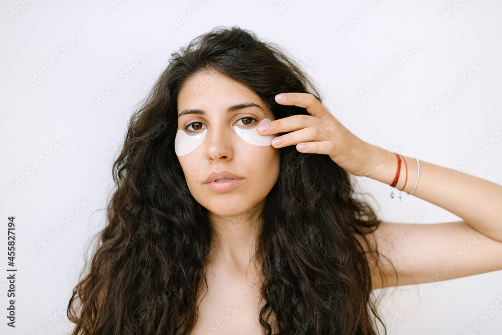 Woman Using Under-Eye Patches Woman Using Under-Eye Patches