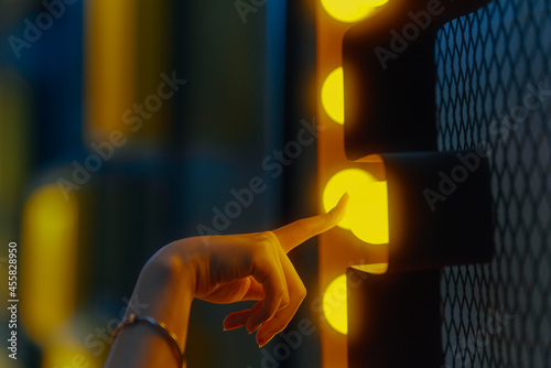 woman hand touch light