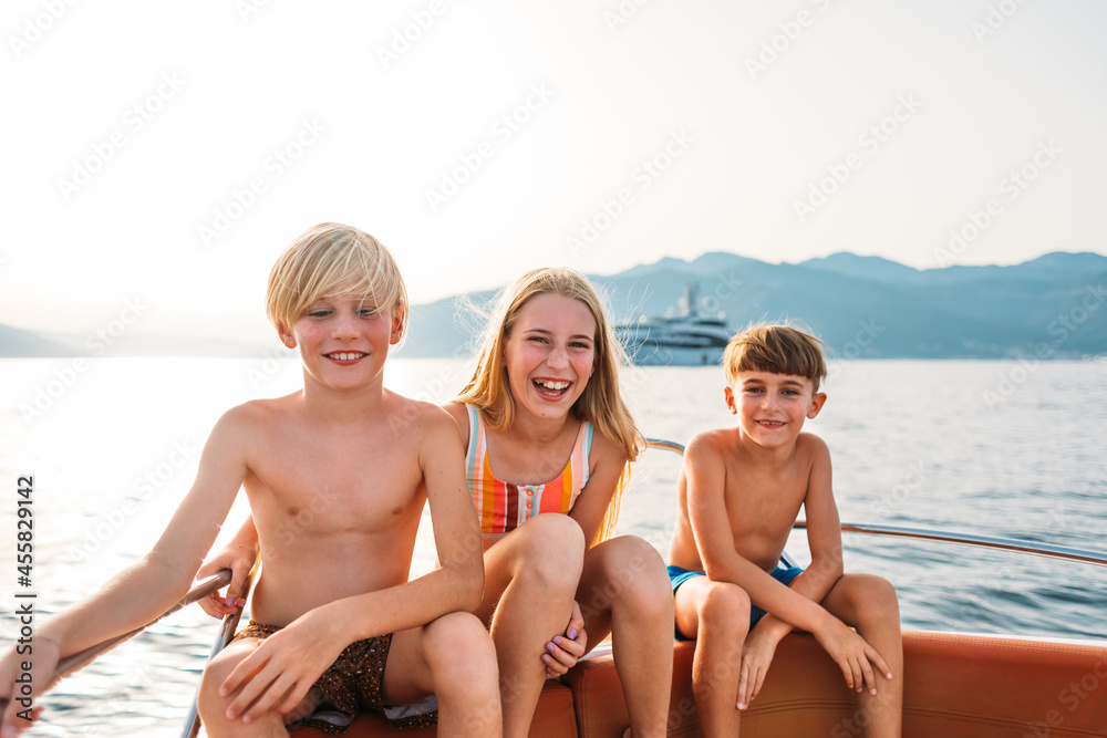 © Studio Firma/Stocksy - Kids in Boat
