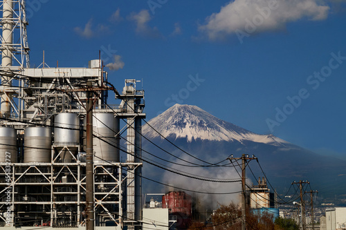 View of Mount Fuji and power plant in foreground photo