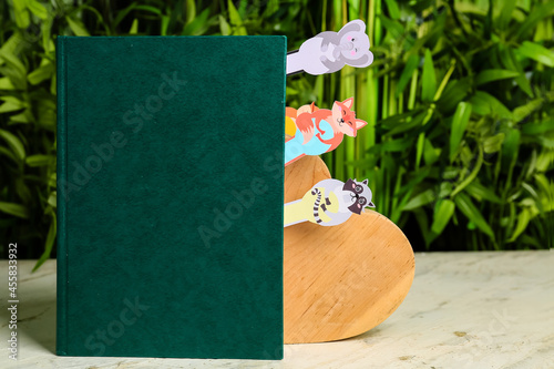 Green book with cute animal...