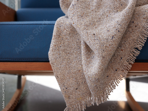 Wool plaid on blue armchair photo
