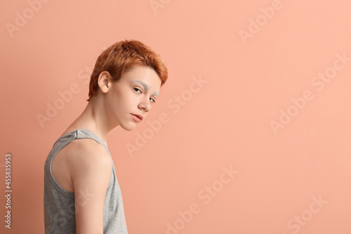 Teenage boy with dyed eyebr...
