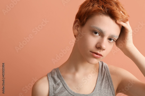 Teenage boy with dyed eyebr...