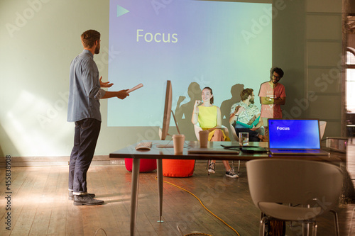 Business people preparing audio visual presentation on Focus