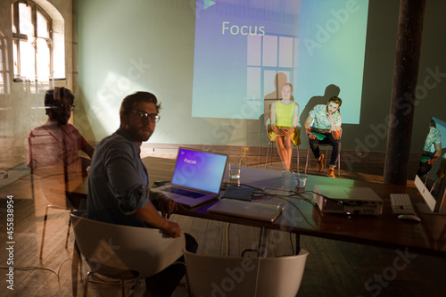 Business people preparing audio visual presentation on Focus