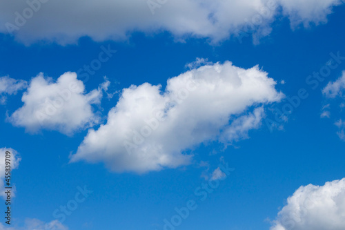 Bright blue sky with clouds.