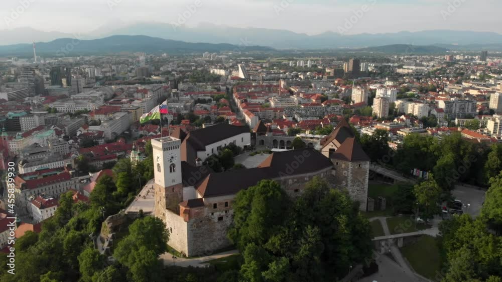 Flying over Ljubljana castle with drone in overseeing the city buildings Flying over Ljubljana castle with drone in overseeing the city buildings
