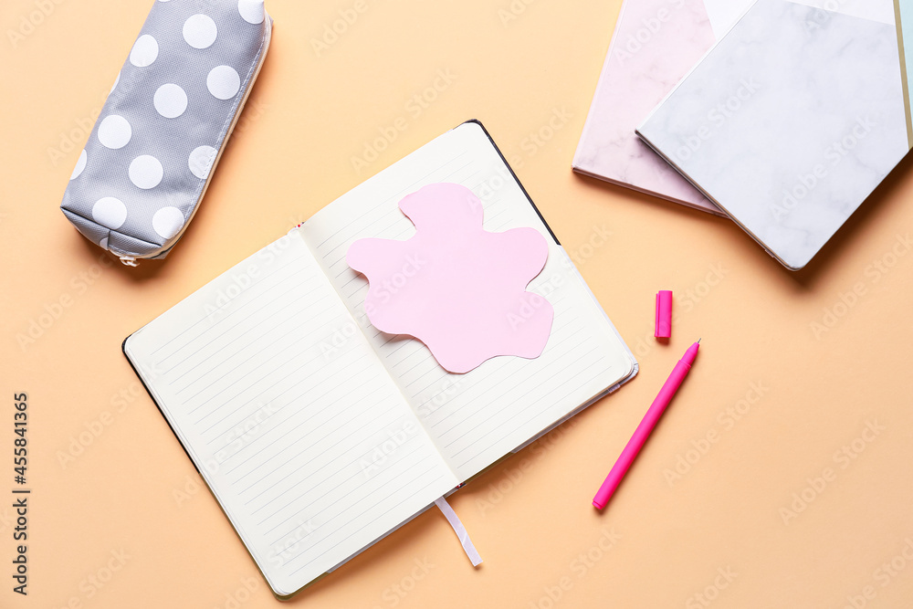 Blank notebook and stationery supplies on color background Blank notebook and stationery supplies on color background