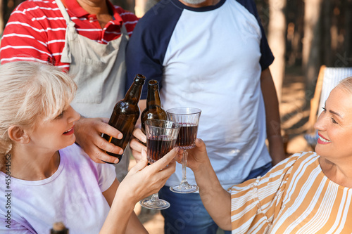 Mature people drinking at b...