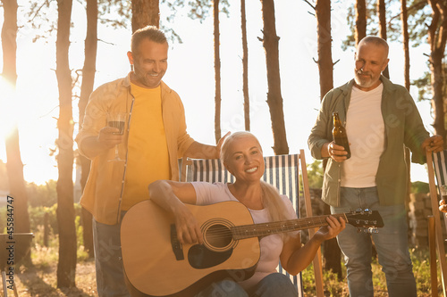 Mature people with guitar a...