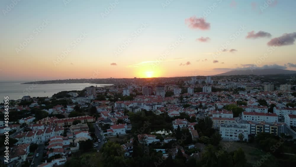 Aerial view over the city of Cascais, sunset in Lisbon, Portugal - tracking, drone shot Aerial view over the city of Cascais, sunset in Lisbon, Portugal - tracking, drone shot