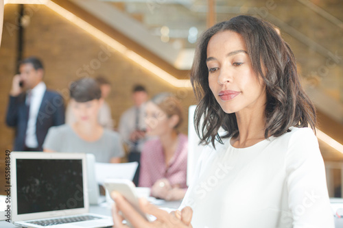 Portrait of confident businesswoman in office Free Download Portrait of confident businesswoman in office - GFXLoad