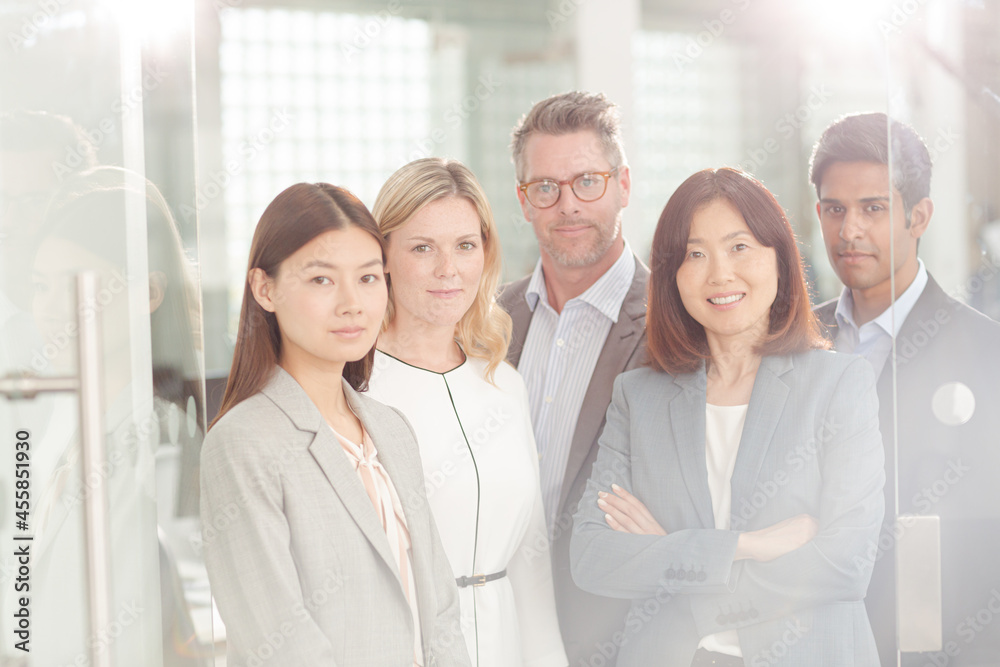 Portrait of confident business people in sunny office Portrait of confident business people in sunny office