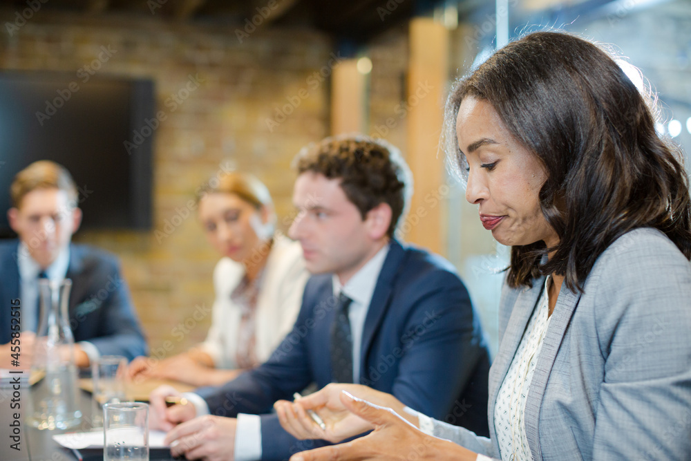 Business people talking in conference room Business people talking in conference room