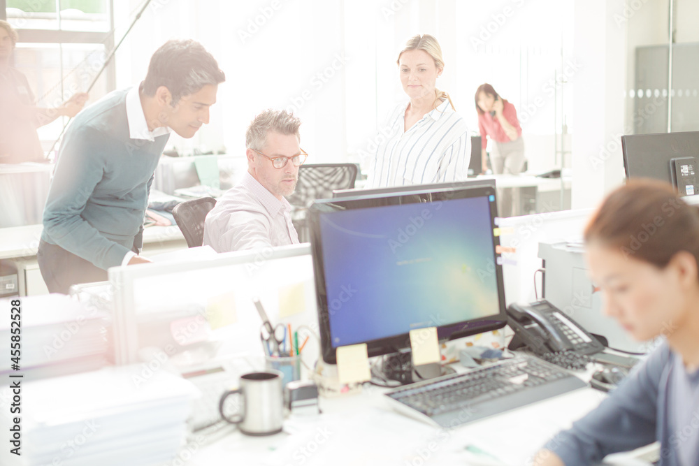 Businesswoman working at desk in office Businesswoman working at desk in office