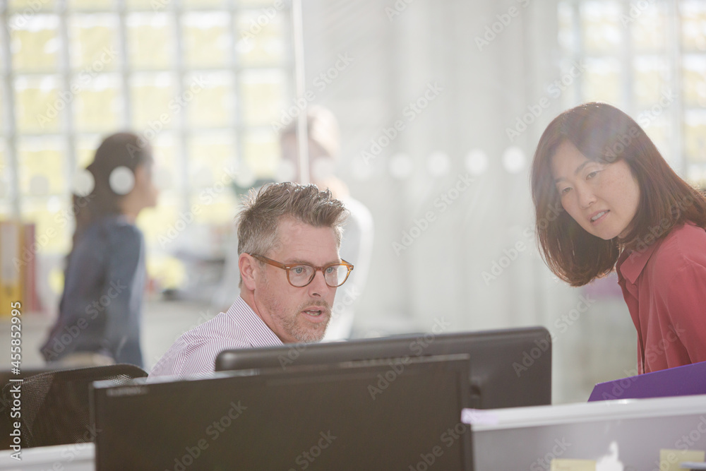 Business people working at computer in office Business people working at computer in office