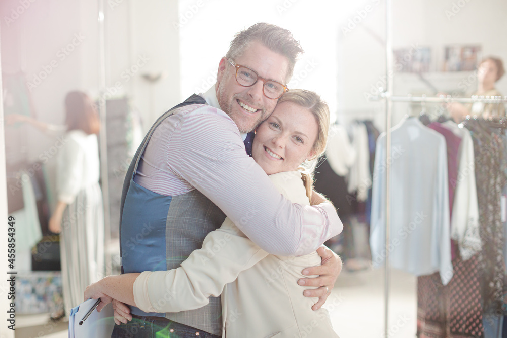 Portrait smiling fashion designers in office Portrait smiling fashion designers in office