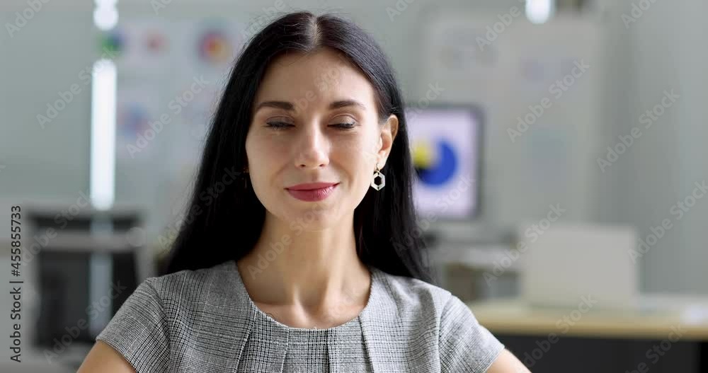 Cute confident adult caucasian businesswoman with beautiful face looking at camera positive posing in office. Happy woman manager or executive look sitting and smile in friendly and warm feeling. Cute confident adult caucasian businesswoman with beautiful face looking at camera positive posing in office. Happy woman manager or executive look sitting and smile in friendly and warm feeling.