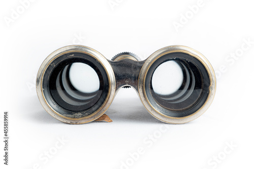 antique binoculars on white background from front