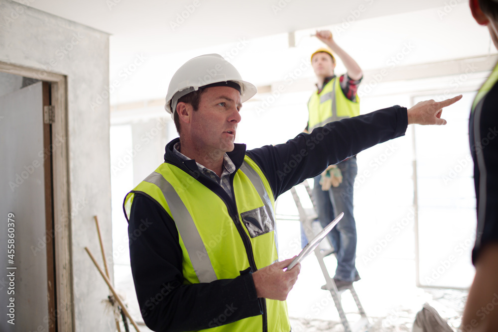 Foreman with digital tablet at construction site Foreman with digital tablet at construction site