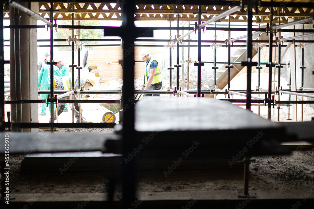 Construction workers at construction site Construction workers at construction site