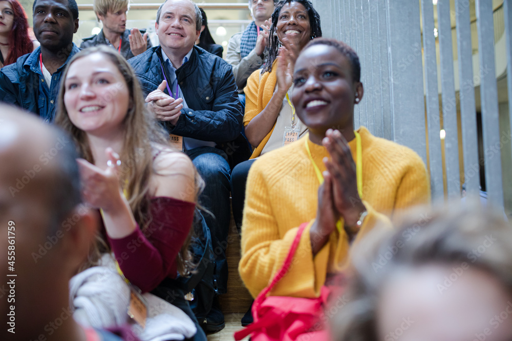 Fototapeta premium Smiling audience clapping