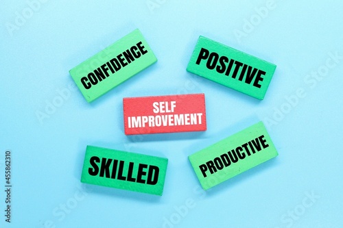 colored boards with words for self -improvement. self improvement concept