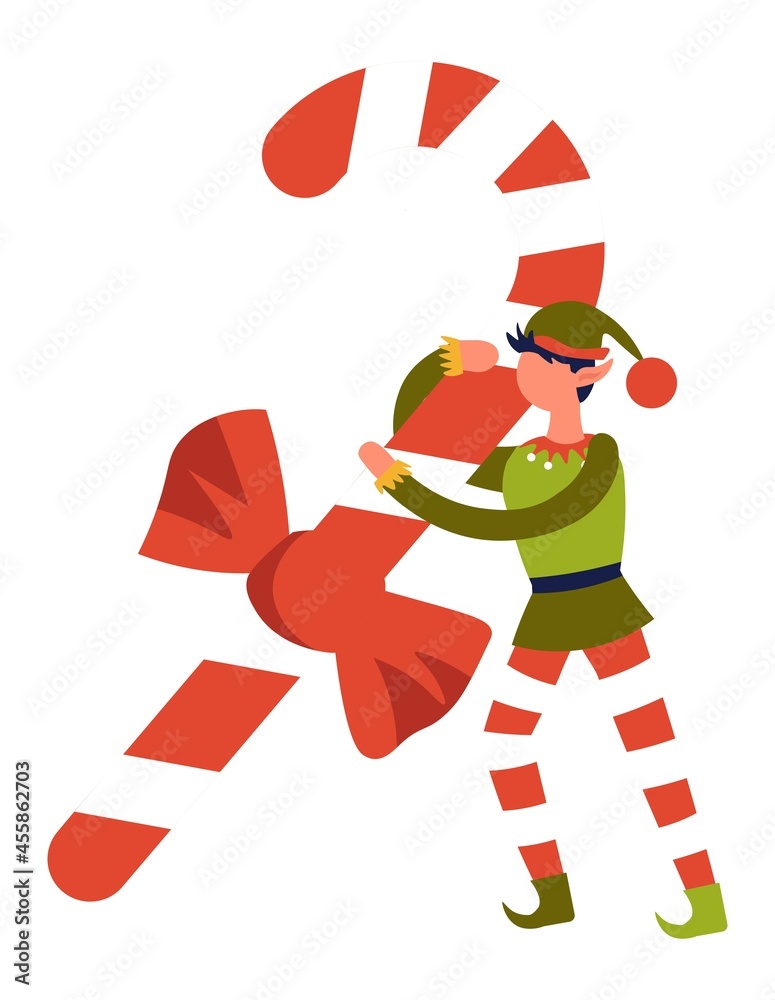 Elf in costume carrying large striped candy stick Elf in costume carrying large striped candy stick
