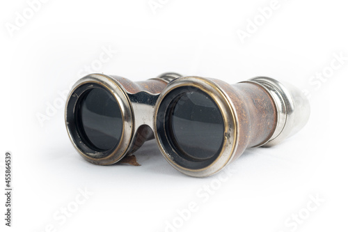 Antique binoculars on white background