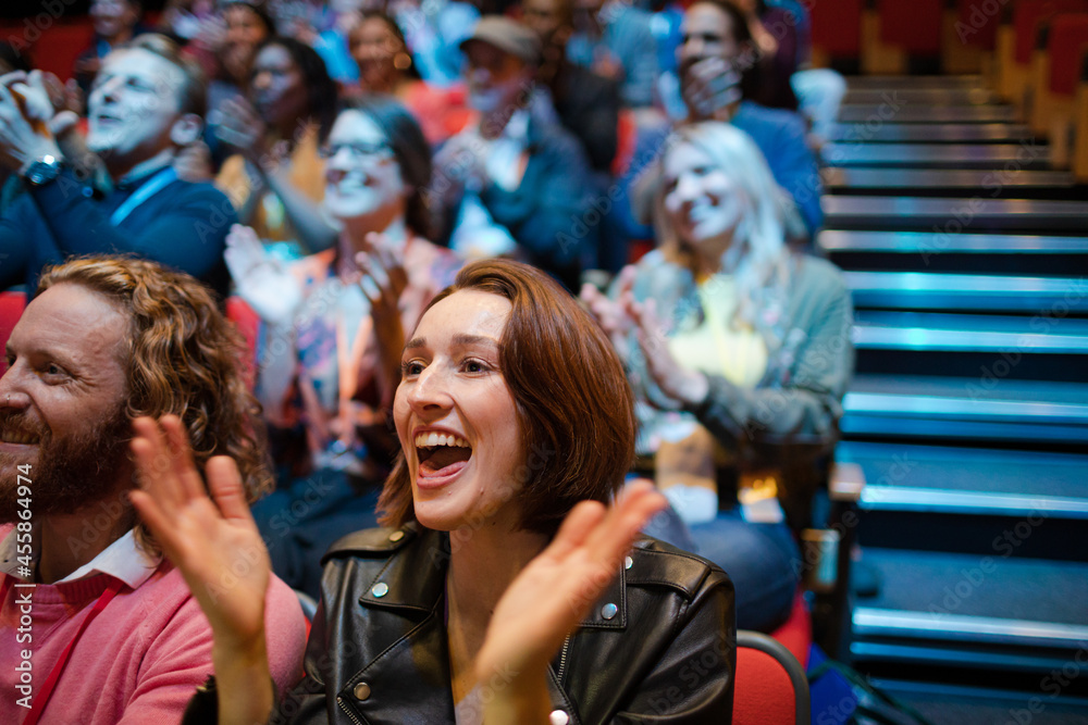 Fototapeta premium Smiling, excited audience cheering