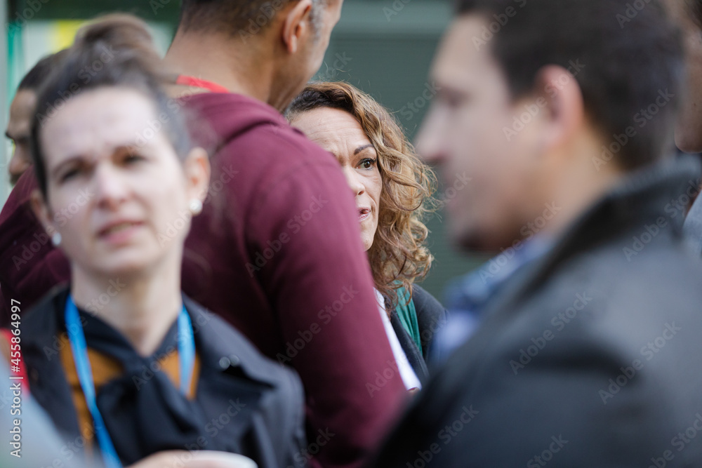 People talking outside auditorium People talking outside auditorium