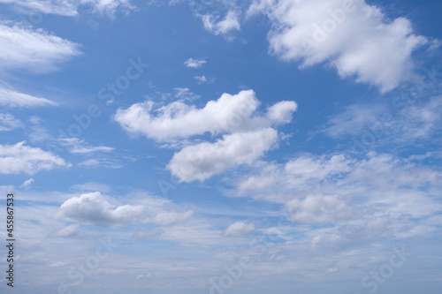Cloudy blue sky with white cloud in daytime, space for text on background. © DesignStory