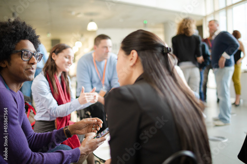 People talking in hall during conference break