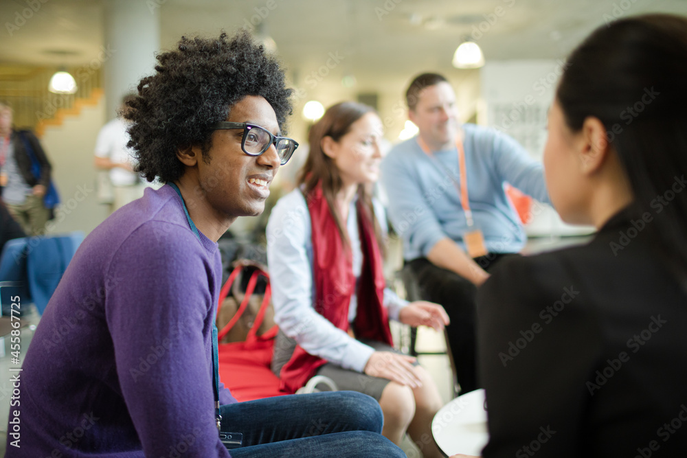 People talking in hall during conference break