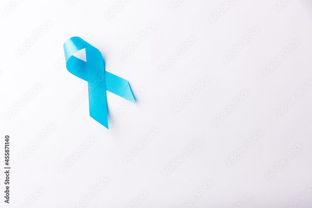 Obraz premium November light blue ribbon, studio shot isolated on white background, Prostate cancer awareness month, men's health concept