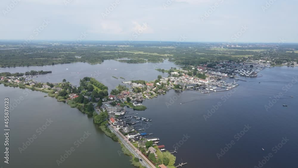 Loosdrecht Loosdrechtse Plassen aerial drone view on a summer day houses and road dyck road running through the water. Loosdrecht Loosdrechtse Plassen aerial drone view on a summer day houses and road dyck road running through the water.
