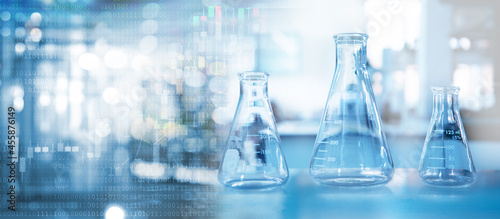 clear glass three flask in chemistry science research lab blue banner background..