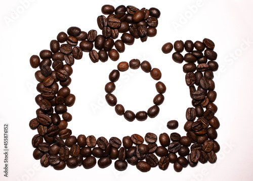 coffee beans on white background. camera with coffee beans. 