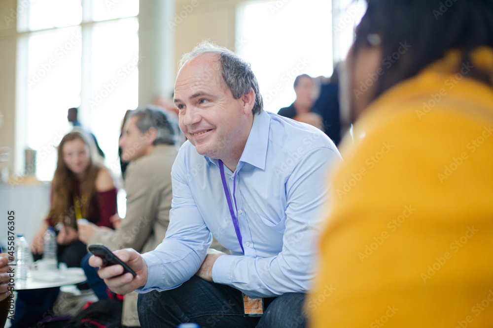 Naklejka premium People talking during conference break