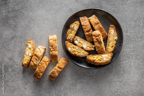 Italian cantuccini cookies on plate. Sweet dried biscuits with almonds.