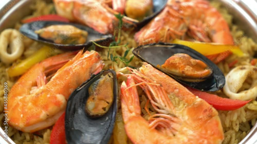 Seafood Paella with prawns, clams, mussels on saffron rice - Spanish food style Seafood Paella with prawns, clams, mussels on saffron rice - Spanish food style