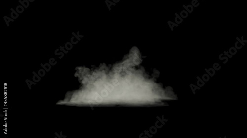 White smoke waves rushing towards the camera, puff of dust isolated on a black background photo