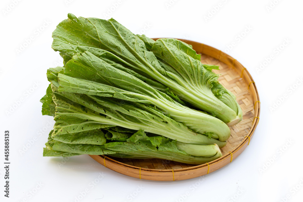 Mustard Green in bamboo basket on white background. Mustard Green in bamboo basket on white background.
