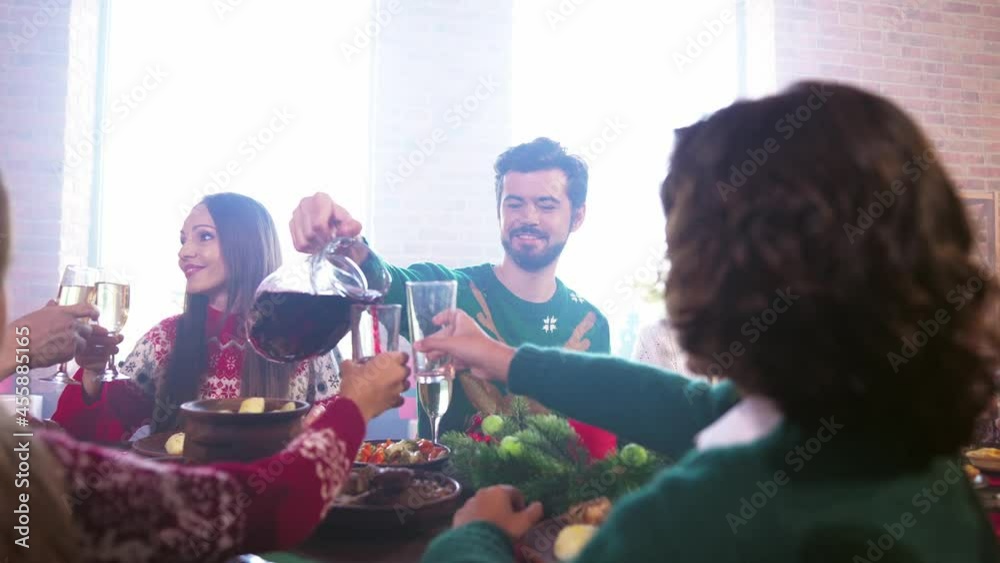 Hospitable caring dad hold jar pour fresh juice x-mas dinner toast concept
